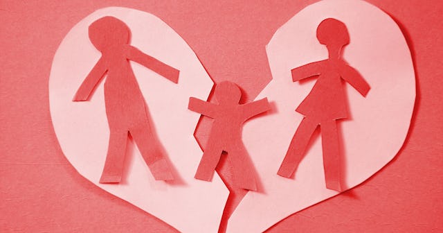 A paper in a shape of parents in the broken heart while their child is connecting it