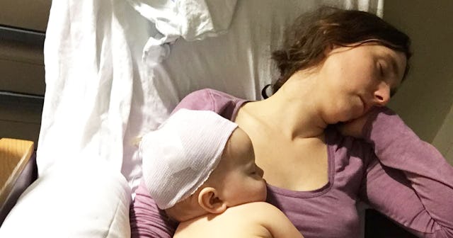 A baby diagnosed with viral meningitis resting on her fully vaccinated mother's chest