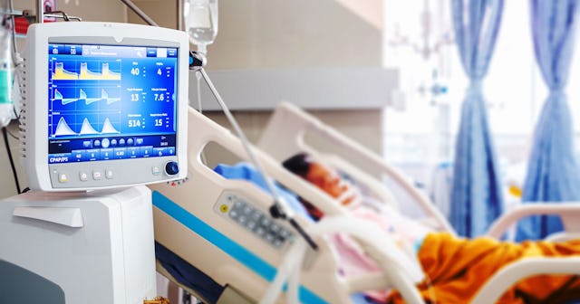 A young boy lying hurt in the hospital after experiencing a tragic fall