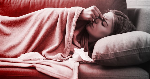 Woman suffeing from anxiety and lying down on a couch