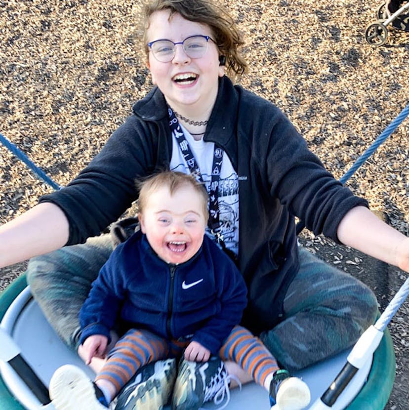 Amber Gale and her son enjoying their day while swinging on a big tire swing