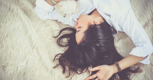 how to fix sleep schedule, girl falls asleep with dog