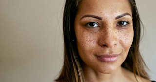 alpha female traits, Close up of smiling mixed race woman