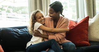 A mother sitting with her daughter with whom she talks about sex even though she was a taboo topic i...