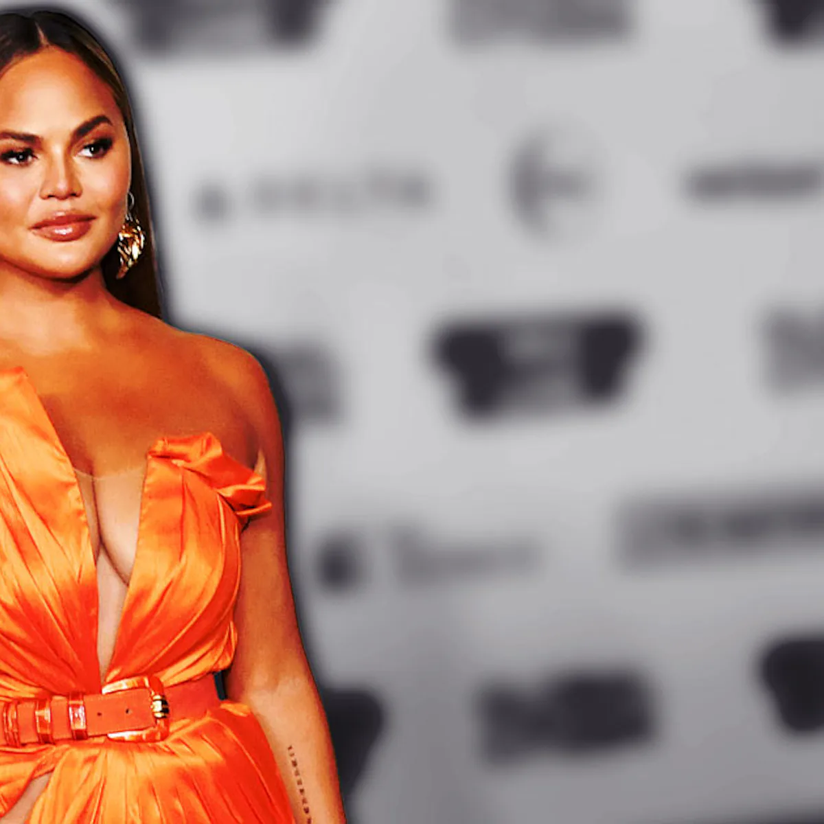 chrissy teigen orange dress Chrissy Teigens red carpet look needed a reshuffle | HELLO!