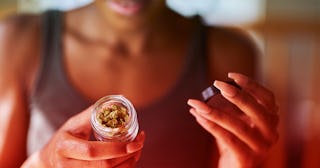 Woman holding a jar of pot