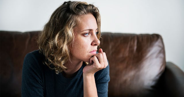 A Woman Leaning Her Chin On Her Hand And Looking To The Side After Her Ex Moved On Quickly