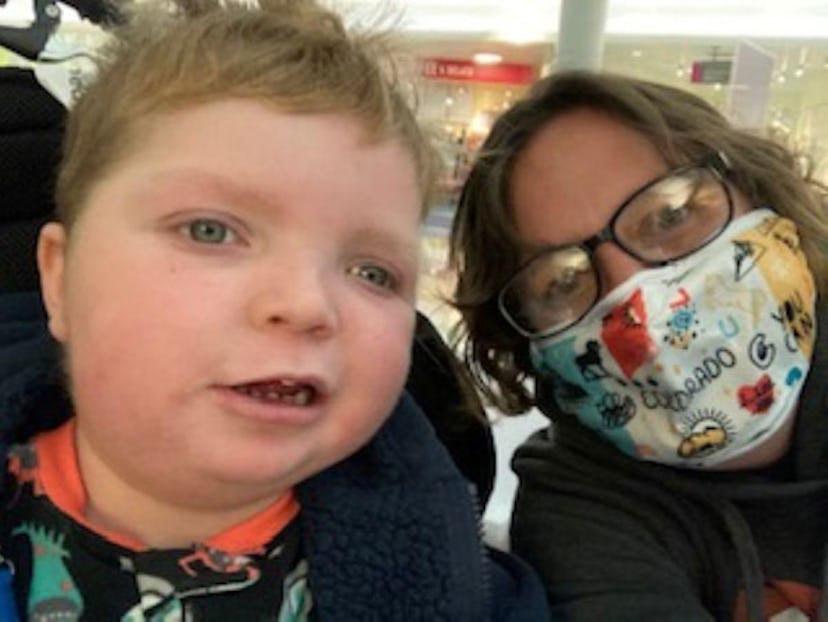 A mother taking a selfie with her son Cameron, who is sitting in his wheelchair, while she is wearin...