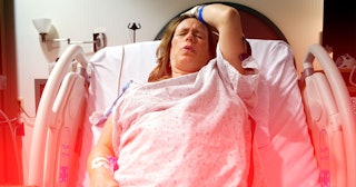 A woman's birth photo that isn't idyllic as she is experiencing severe pain