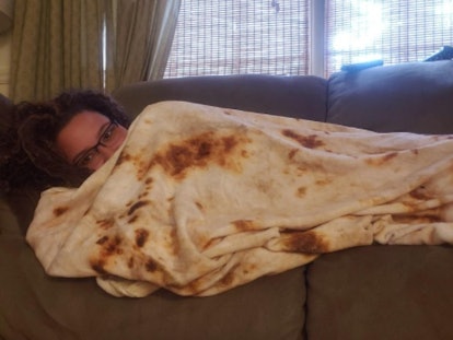 woman on a couch in a blanket