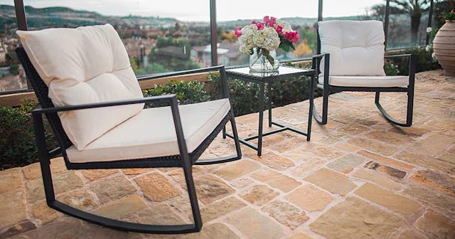 White and black Suncrown outdoor rocking bistro set on a balcony
