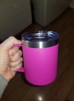 A pink insulated coffee mug 