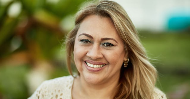 Mid-life blonde woman smiling at the camera
