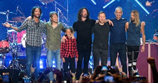 Drumming prodigy Nandi Bushell standing on stage with the Foo FIghters