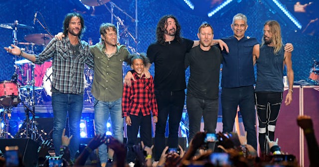 Drumming prodigy Nandi Bushell standing on stage with the Foo FIghters