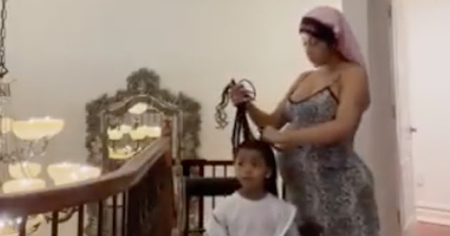 Cardi B using LCO method braiding Kulture's hair