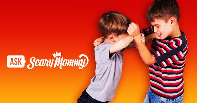 A boy hitting another boy back in front of an orange background with the Scary Mommy logo.