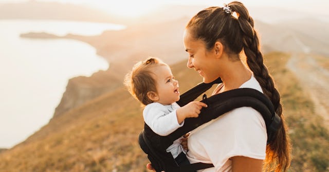 Woman with baby in sunlight — names that mean life