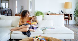 Mother and child reading a book — short moral stories for kids.