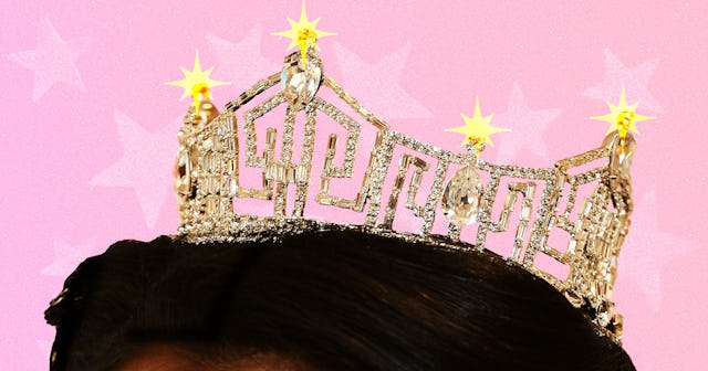 An illustration of the top of a woman's head with a tiara on it 
