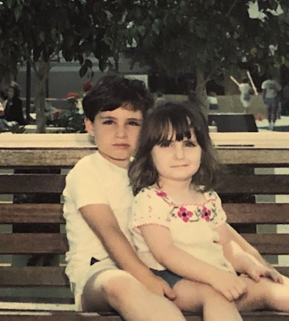 Amy B. Chesler and her brother who abused her and killed their mother as children sitting on a bench