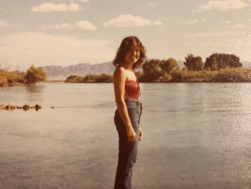 Amy B. Chesler's mother when she was a teenager standing next to a river