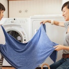 Woman and daughter folding laundry — laundry symbols.