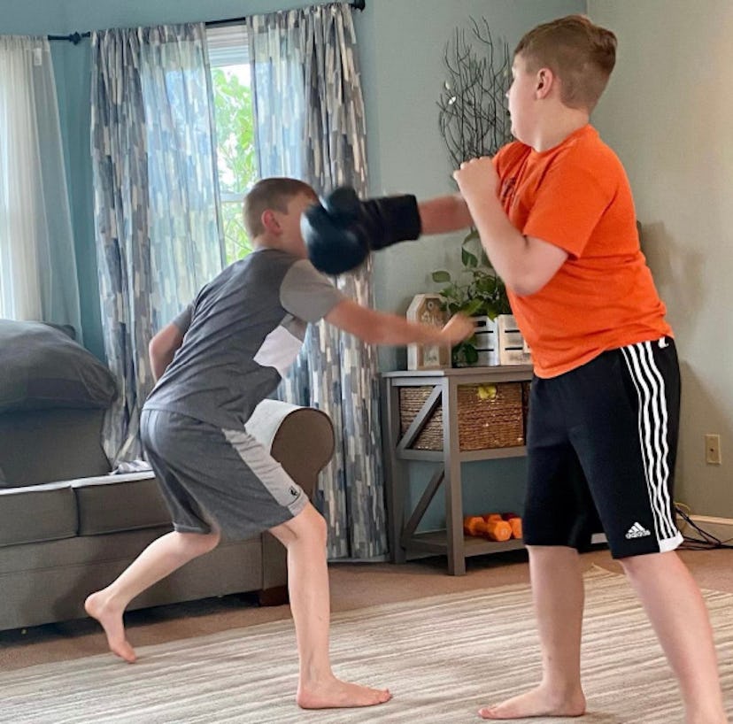 Two boys boxing with each other
