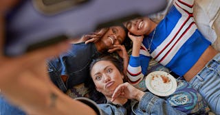 Group of best friends taking a selfie together.