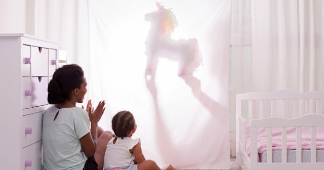 Mother and child watching unicorn puppet — unicorn crafts.
