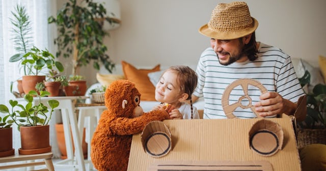 Father and daughter playing with toy monkey — monkey names.
