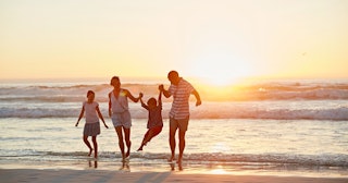 Family on beach — Words to describe the ocean.