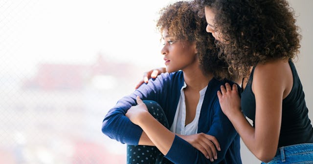 Young woman consoling her friend — vulnerability quotes.
