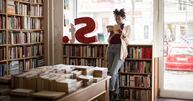 Woman reading in library — cool words