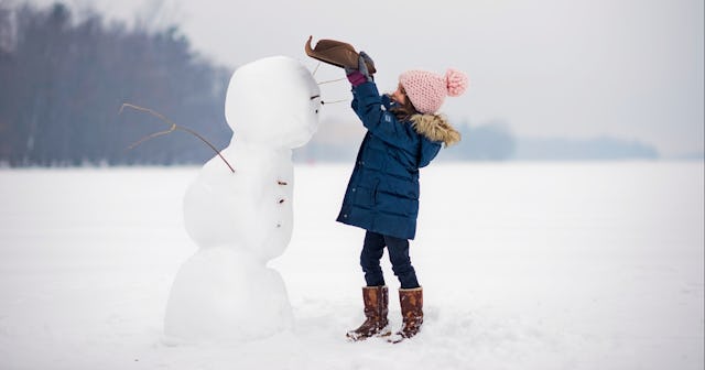 Girl building a snowman — snowman names.
