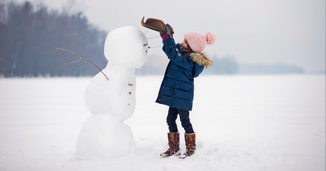 Girl building a snowman — snowman names.