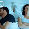 Woman lying down in a bed next to her husband, who's snoring doesn't let her sleep and makes her sta...