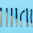 Burnt matches going from least burnt to completely burnt, representing burnout 