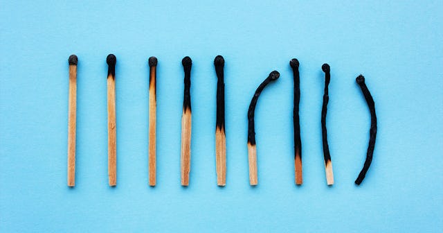 Burnt matches going from least burnt to completely burnt, representing burnout