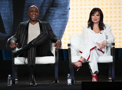 Wayne Brady and Mandie Taketa a stage