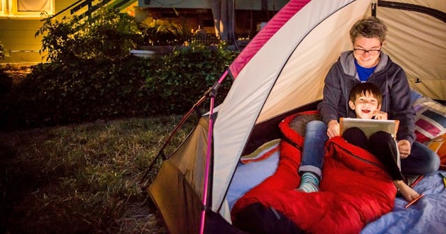 Kids laughing in tent — camping jokes and puns.