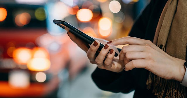 A woman holding her mobile phone