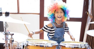 Girl playing drums — drummer jokes and puns.