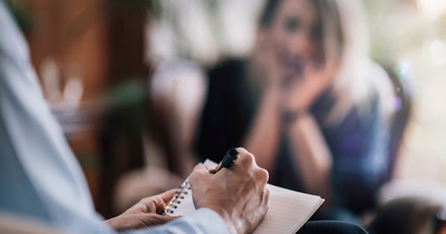 Woman at the healing trauma session with the therapist