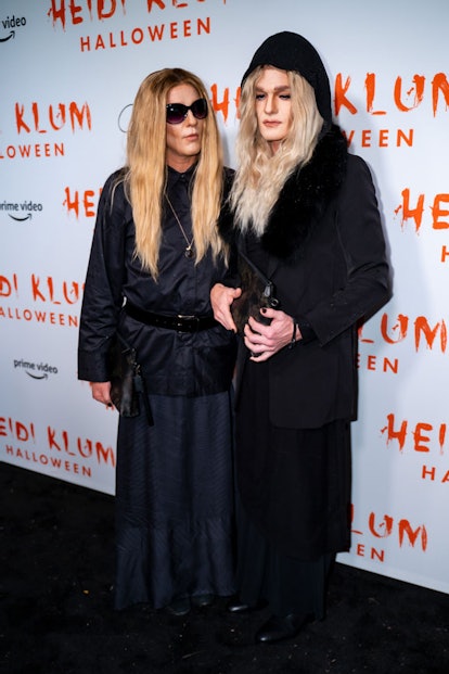 Neil Patrick Harris and David Burtka dressed up as the Olsen twins wearing all-black outfits for Hal...