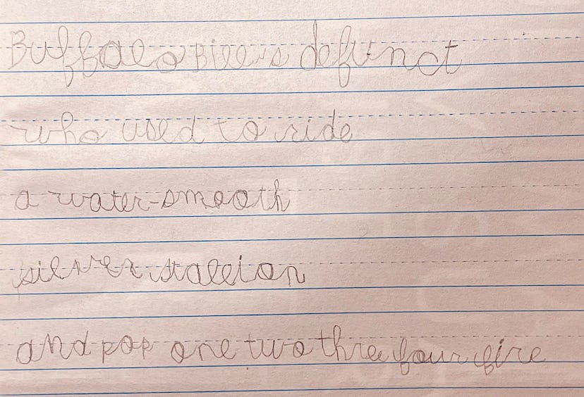 A used cursive writing practice sheet with writings on it