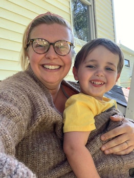 Lindsay Wolf, taking a selfie with her son in front of their house