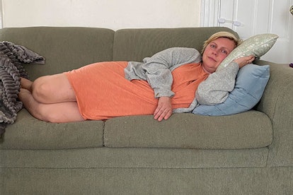 Lindsay Wolf lying on a couch after getting out from the hospital