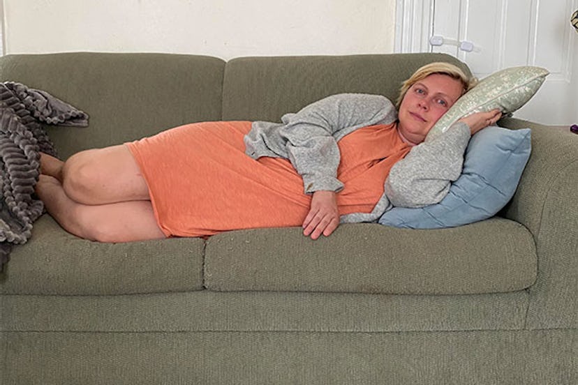 Lindsay Wolf lying on a couch after getting out from the hospital