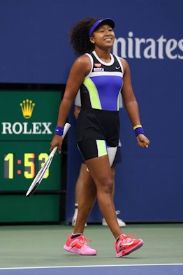 Naomi Osaka playing a tennis match